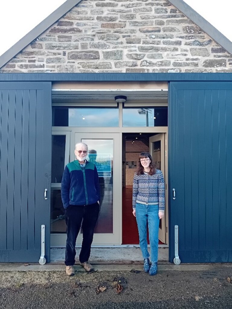 Bryan Milner and Alice Mainland from the Rousay Egilsay and Wyre Heritage SCIO, outside the newly completed front of the Store.