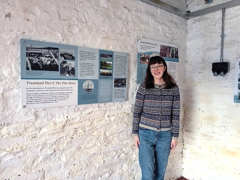 Alice next to some of the interpretation panels that she researched.