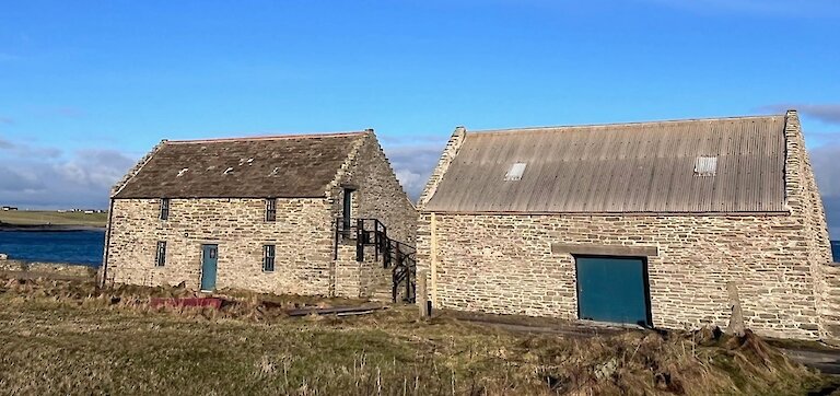 The newly restored Nouster Boat Store (right) next to the Kelp Store.